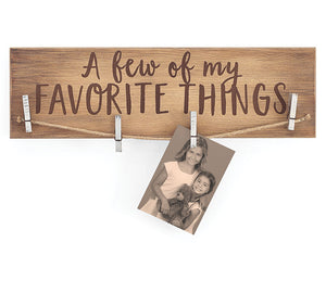 Wooden Sign with clothes pins to hang memorabilia, photos etc. Text- A Few of My Favorite Things is painted on
