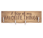 Wooden Sign with clothes pins to hang memorabilia, text- A Few of My Favorite Things is painted on