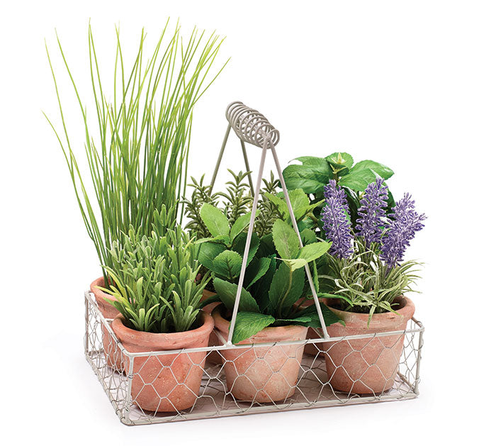 Six different artificial herbs in clay pots displayed in a white chicken wire holder