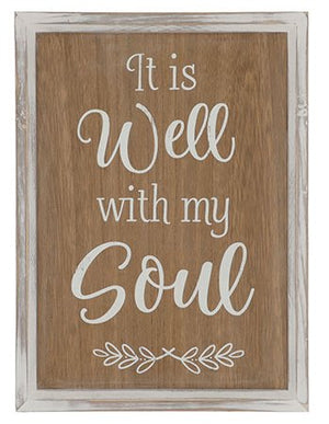Wooden wall hanging with text: It is well with my soul