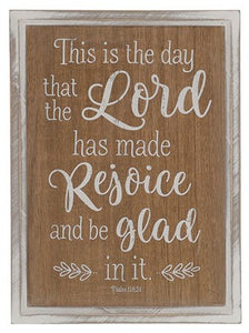 Wooden wall hanging with text: This is the day that the Lord has made, rejoice and be glad in it
